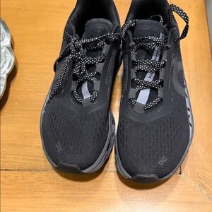 On Running Women’s Black and Gray Athletic Shoes